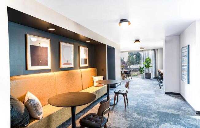 Thoughtfully designed gathering spaces at Modera Shoreline offer inviting corners to work, connect, or unwind surrounded by natural light and comfort.