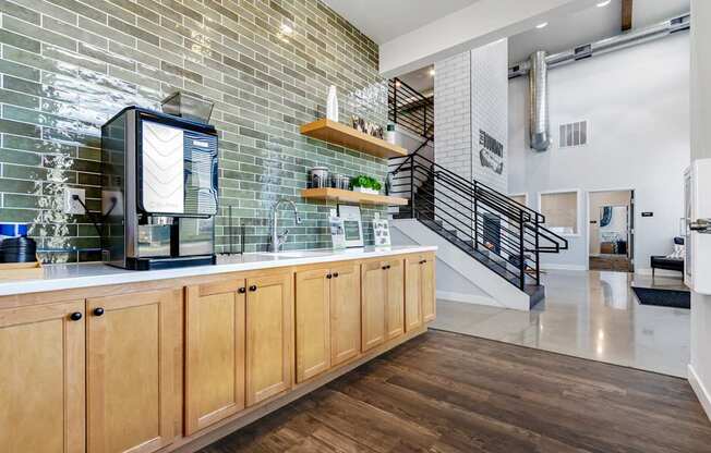A kitchen with wooden cabinets and a glass-fronted coffee machine.