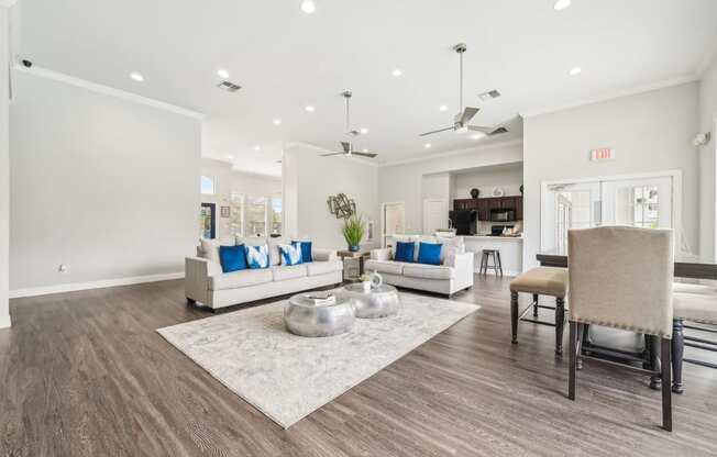 a living room with couches and chairs and a table