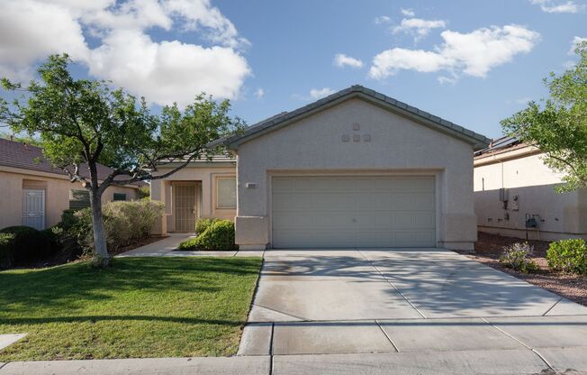 Wonderful Summerlin single story with grass backyard and island kitchen.