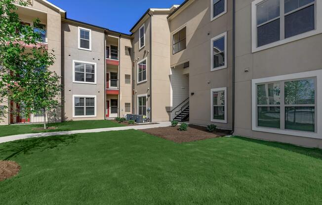 a large lawn in front of a building