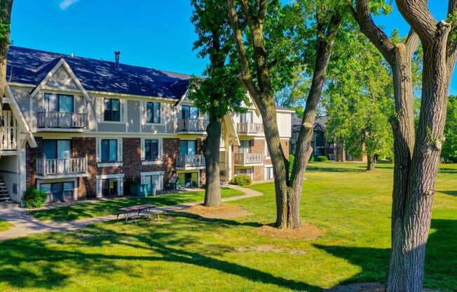 Green Spaces With Mature Trees at Fairlane Apartments, Springfield, MI