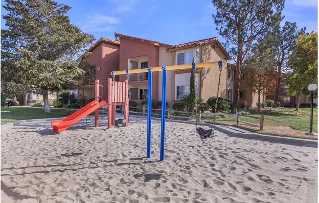 an empty playground in front of a house at Riverview Springs, California