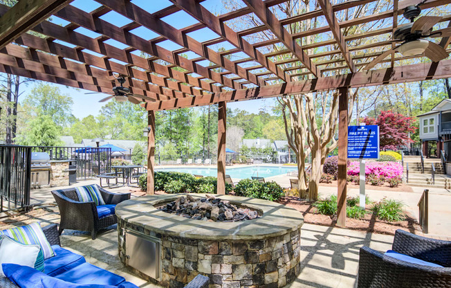 Apartments in Marietta Georgia for Rent – Wood Pointe Apartments - A patio with a fire pit and seating area.