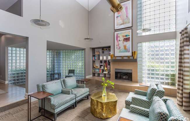 A living room with a fireplace and a large window.