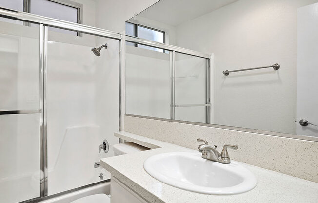 Modern styled bathroom with shower and tub.