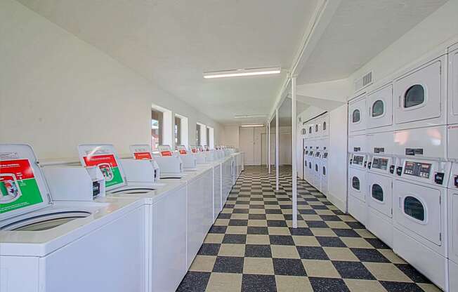 a row of washing machines in a laundromat