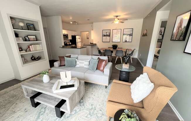 a living room with gray walls and a white rug