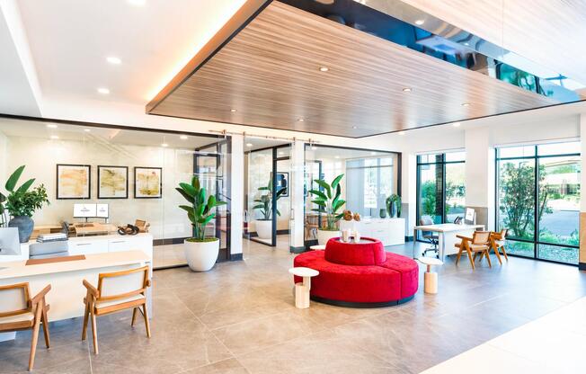 The bright, open leasing office sets a great first impression with sleek finishes, full-height windows, and comfortable seating while you select your new home.