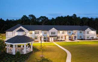 Exterior building and Gazebo with walkway at twilight at Carmel Vista, McDonough, 30253