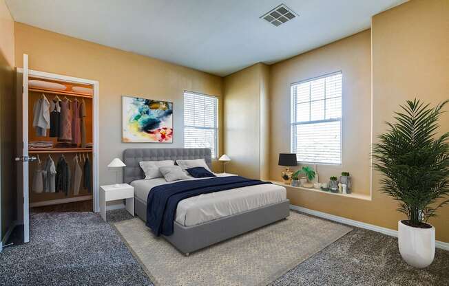 A bedroom with a bed, a plant, and a painting on the wall.