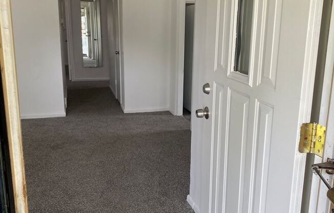 Freshly painted 3 bedroom, 1 1/2bath ranch with basement and garage