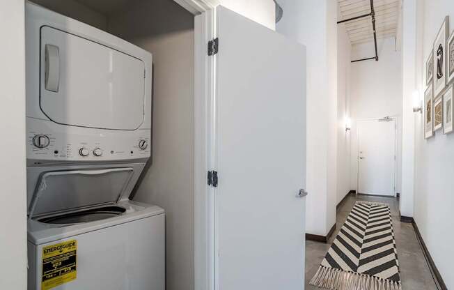 White stacked washer and dryer in the Mill House floor plan at Highland Mill Lofts in Charlotte, NC 28205