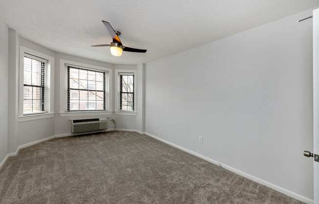 Carpeted Bedroom with Three Windows at Connecticut Plaza Apartments, 2901 Connecticut Ave NW, Washington D.C.