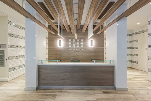 a reception desk in a lobby of a building