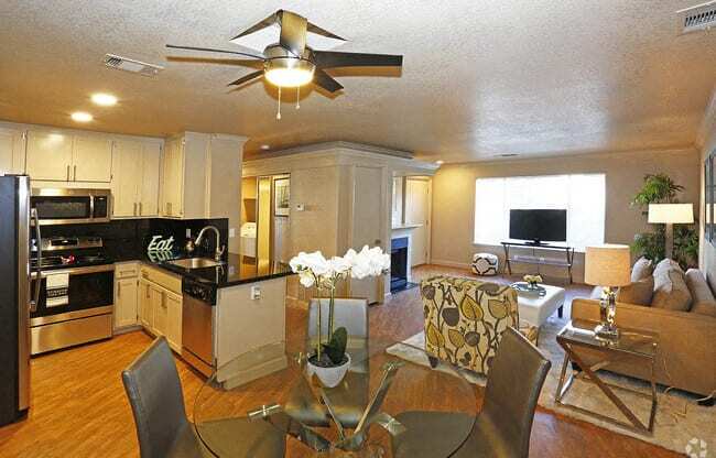 Kitchen, living room, and dining l Quailwood Apts in Stockton 