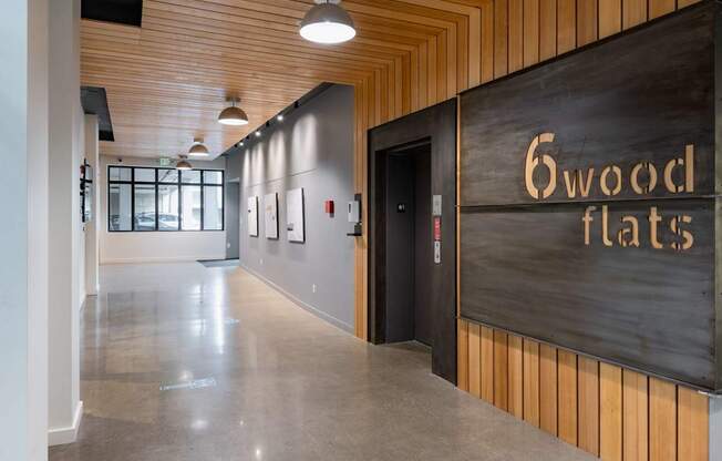 A hallway with a sign that says