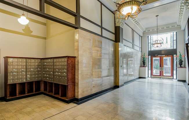 a large room with a large window and a large wooden desk with a glass door in the