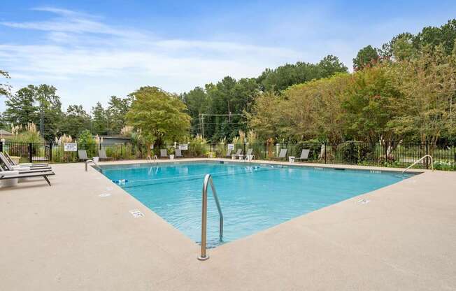 the swimming pool at woodland park apartments