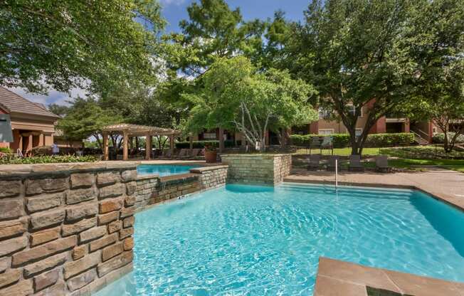 Waterfall in Pool  at Jefferson Place Apartments in Irving, Texas, TX