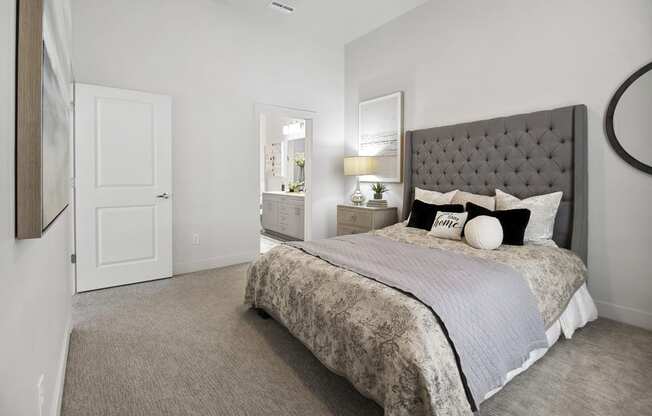 a bedroom with a bed and a door to a bathroom at 200 City View, Utah