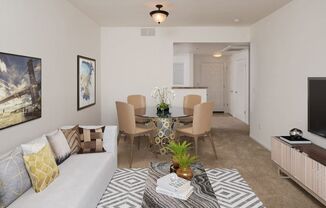 a living room with a couch and a table with a plant on top of it  at Seville at Gale Ranch, San Ramon, CA