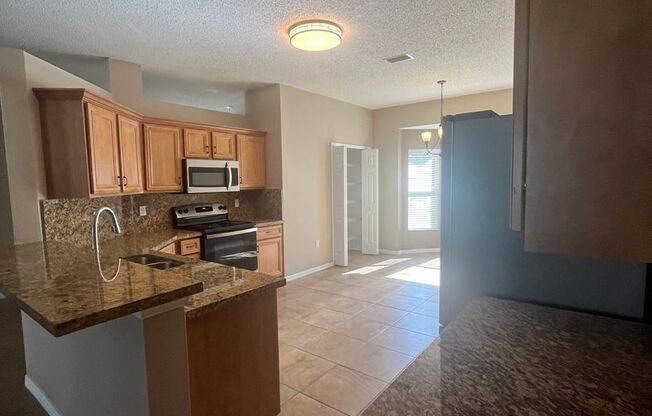 Updated Single family 3 / 2 with Screened in Patio!