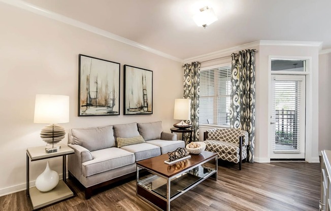 Village at Marquee Station apartments living room with hardwood-inspired flooring