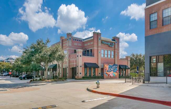 a brick building with a mural on the side of it
