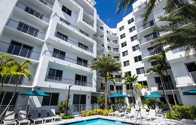 a large swimming pool in front of an apartment building at Saba Pompano Beach, Pompano Beach, 33062