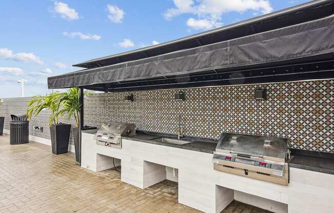 Grilling area with 2 BBQ grills at Twenty2 West luxury apartments in Miami, FL