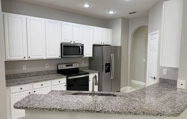 Exquisite 4 bedroom 3 bathroom home in gated community.