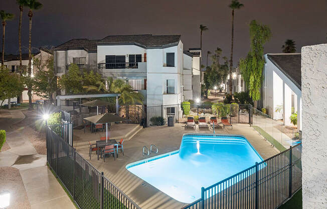 Aerial View of Community Swimming Pool and Pool Furniture at Crystal Creek Apartments located in Phoenix, AZ.