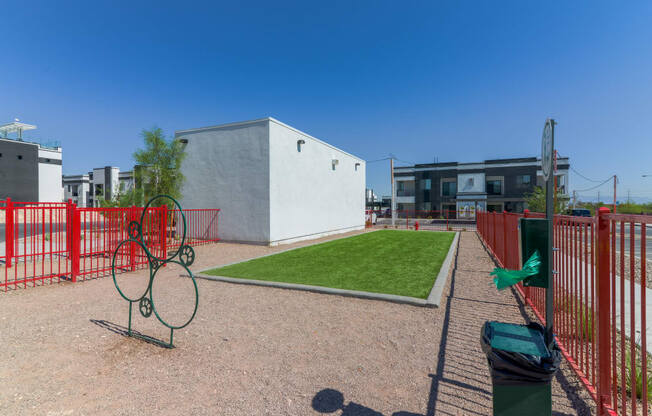 Dog park with grass patch and bathroom bags