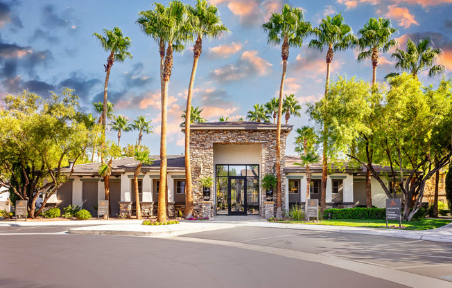 a building with palm trees in front of it