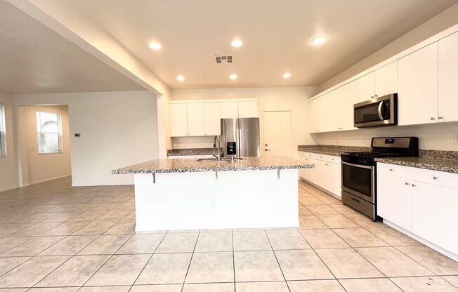 Modern 4BR Home with Island Kitchen, Tile Floors & Great Schools Nearby