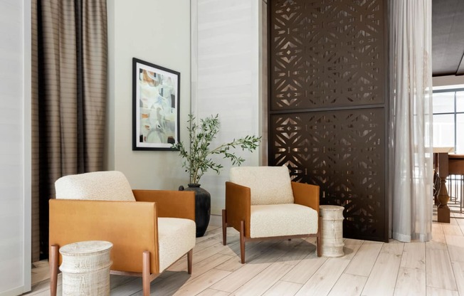 Lounge area with two chairs and decorative vase