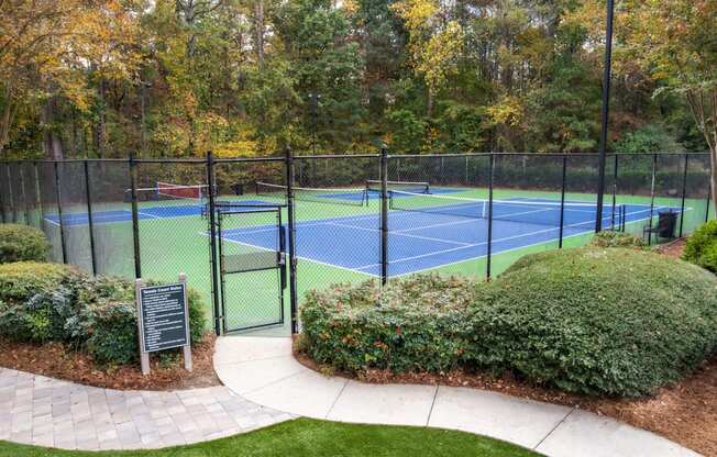 a tennis court with a fence around it