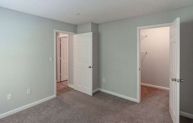 A room with two doors, one of which is open.