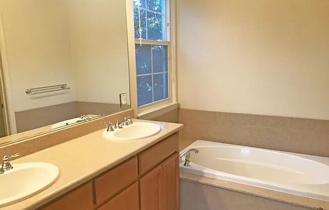 PEACEFUL & CONVENIENT TOWNHOME INCLUDES TWO MASTER SUITES!