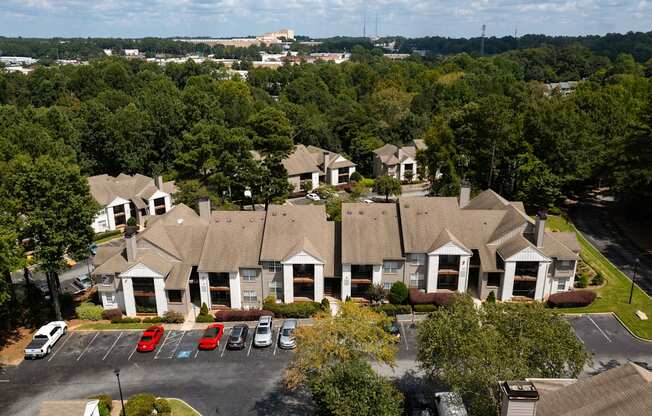 aerial view of apartment homes with parking in front of it