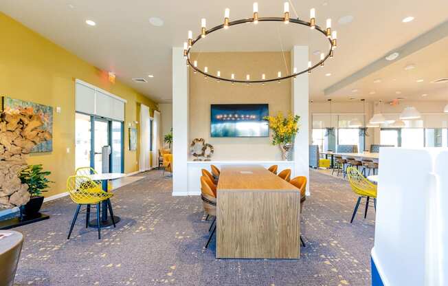 a dining room with a table and chairs in a lobby