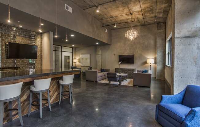 a living room with a bar and couches