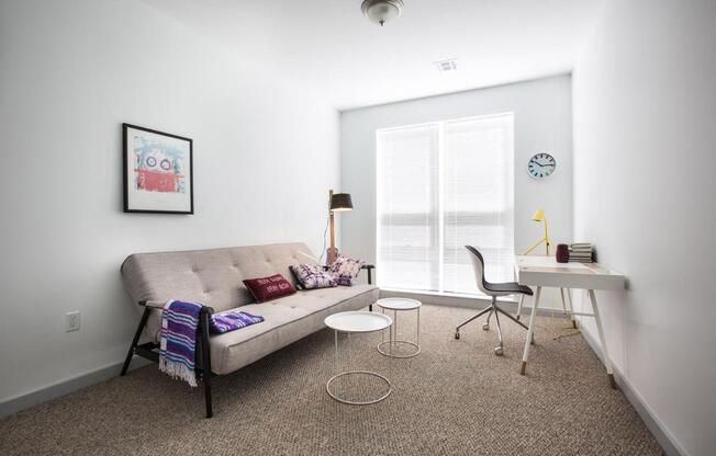 home office with desk, chair and couch