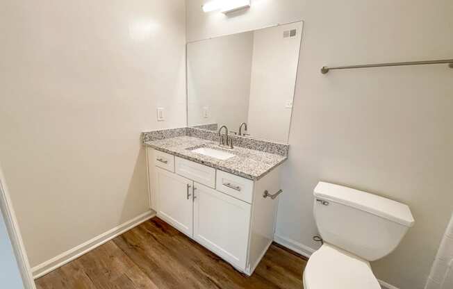The Crest at Berkeley Lake St James renovated main bathroom with granite countertops located in Duluth, GA 30096