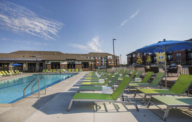 Lounge chairs next to resort-style pool at Ascend at Woodbury new luxury apartments in Woodbury MN 55129