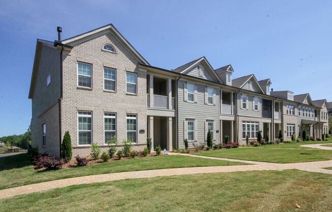 Beautiful John Wieland end unit townhouse never lived in, located in the heart of Waverly.