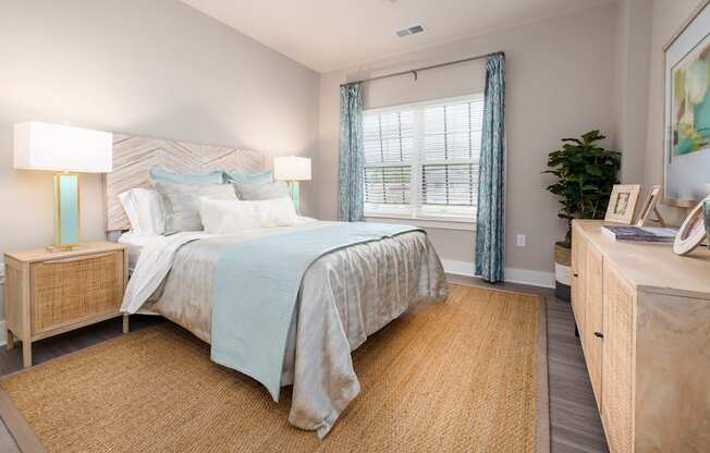 a bedroom with a large bed and a window