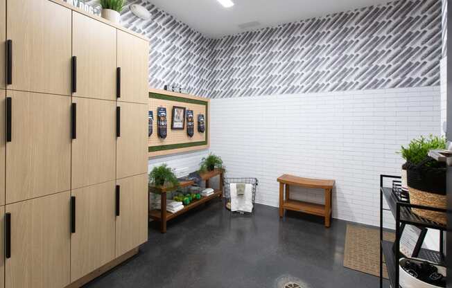 a room with a metal ceiling and a wooden cabinet with plants on top of it