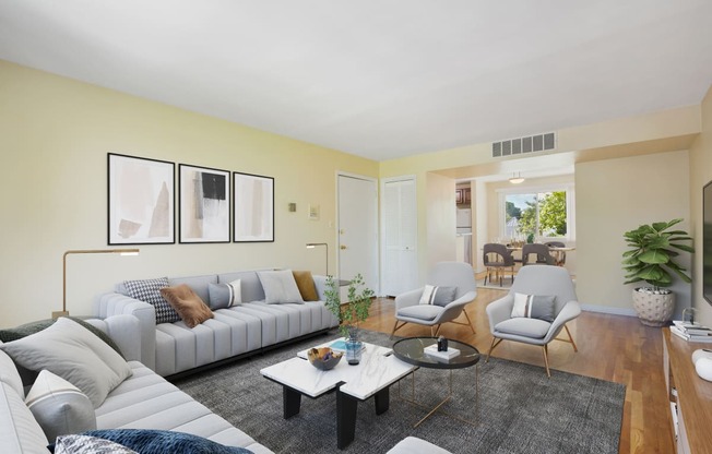 a living room with couches and chairs and a coffee table